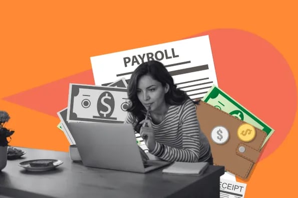 Woman at computer looking at payroll services for startup
