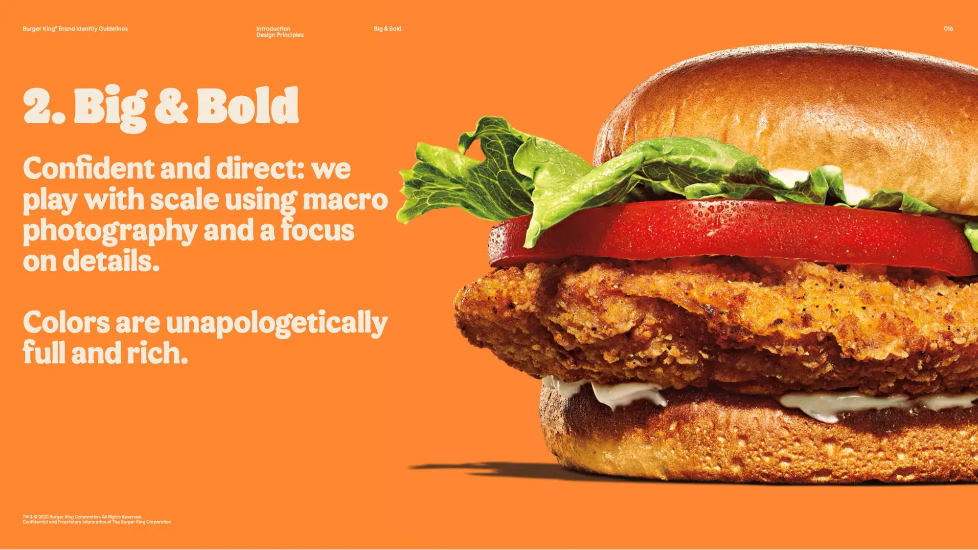 Screencap of a page from Burger King’s brand style guide featuring a close-up of a sandwich against a bright orange background. “Big & Bold. Confident and direct; we play with scale using macro photography and a focus on details. Colors are unapologetically full and rich.” 