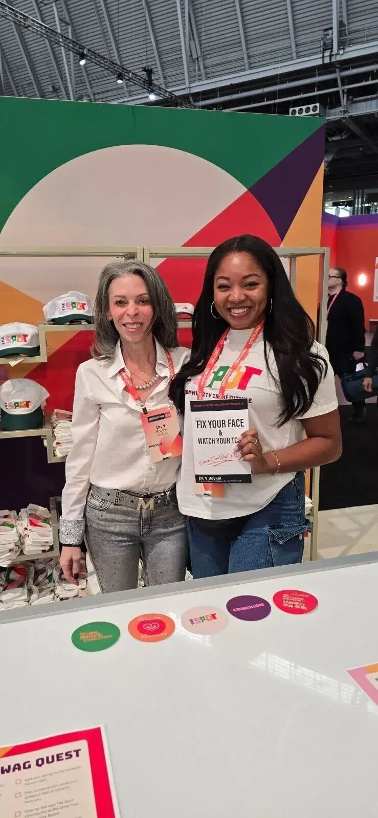 Two women wearing The Spot T-shirts.