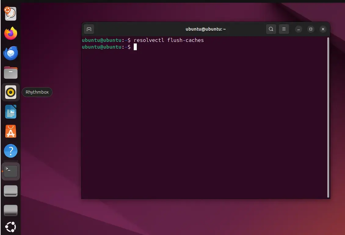 Terminal window on Linux Ubuntu. The command says, “resolvectl flush-caches.”