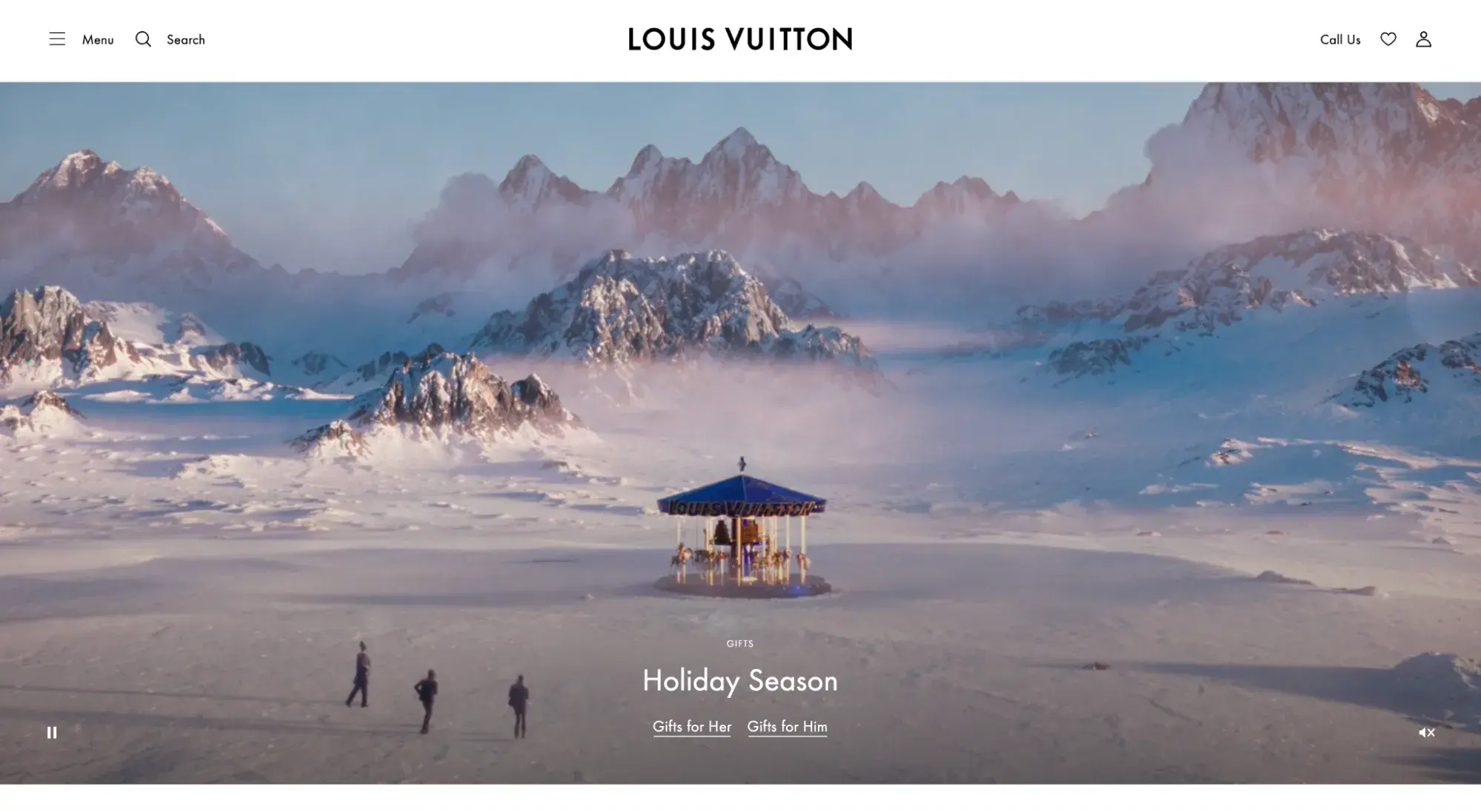 Luxury websites: Louis Vuitton homepage showing a snow-covered, mountainous landscape with a carousel in the middle