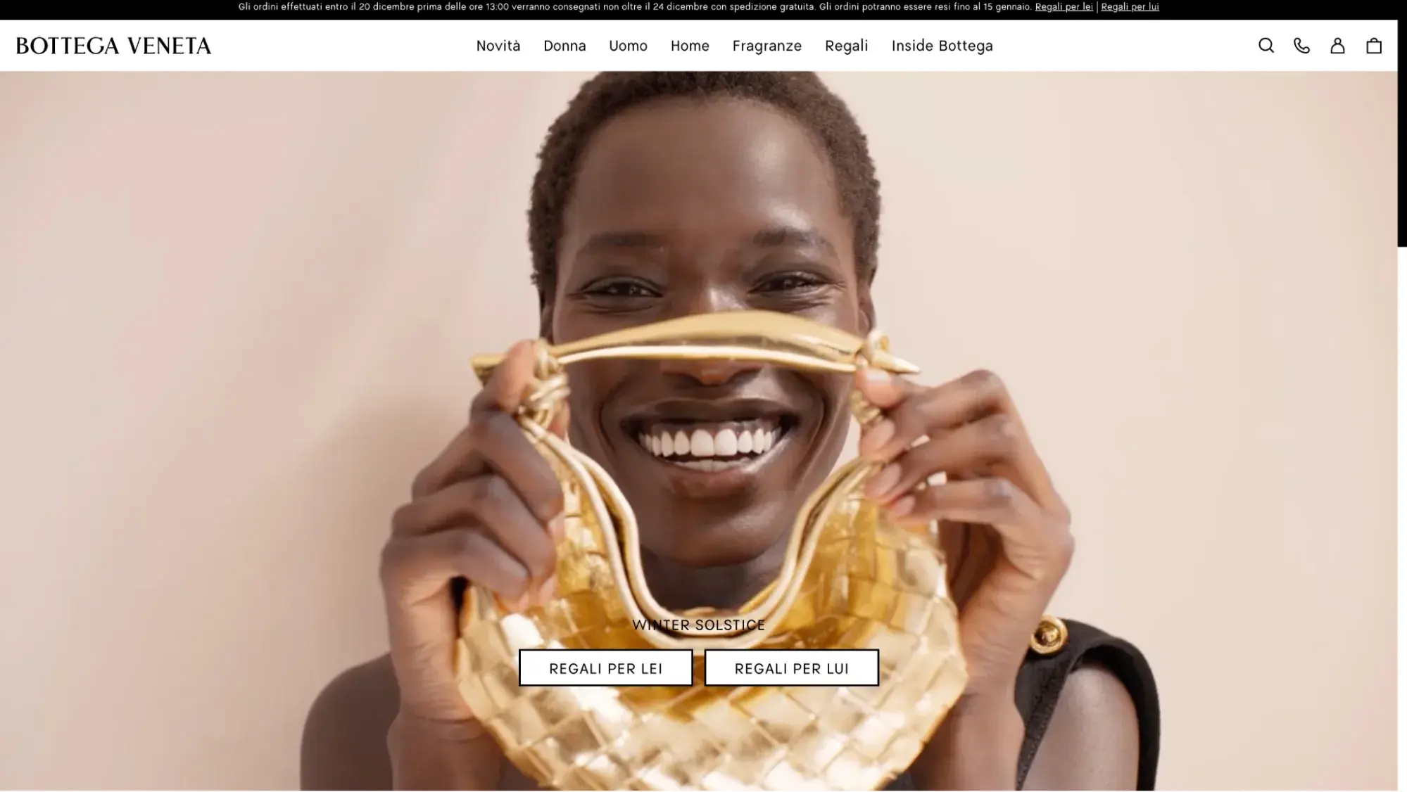 Luxury ecommerce websites example: Bottega Veneta’s homepage shows a smiling woman holding up a bag