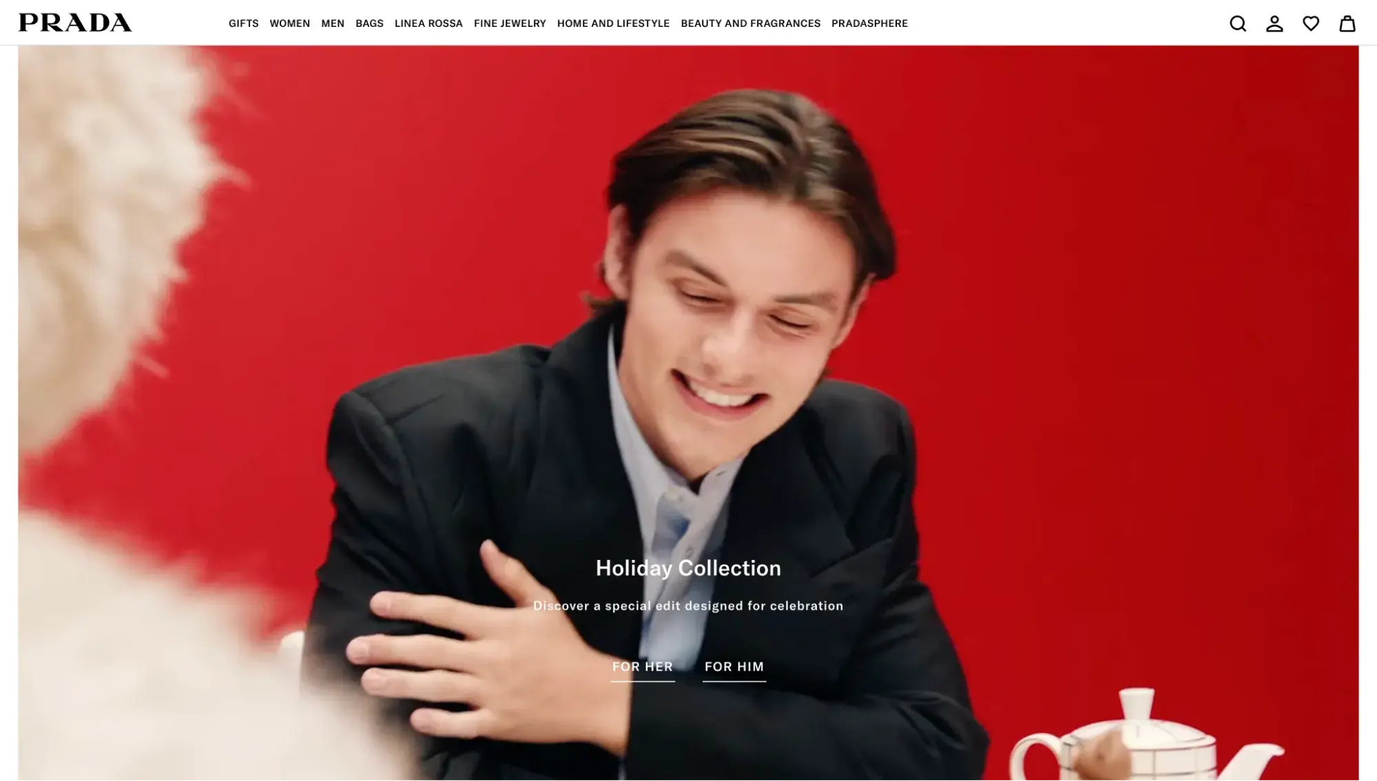 Luxury websites: Prada homepage features a full-screen image of a man in a black suit against a red background