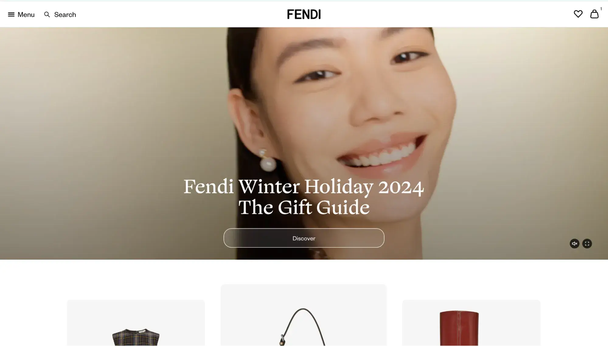 Luxury websites: Fendi’s homepage shows a smiling woman and a call to action to explore its winter holiday gift guide