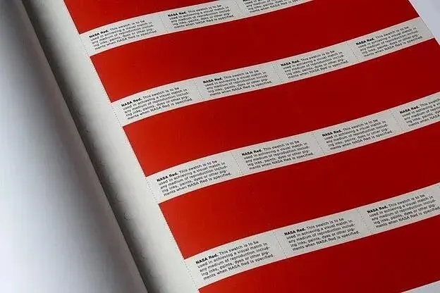 Page of color samples all labeled “NASA red.”